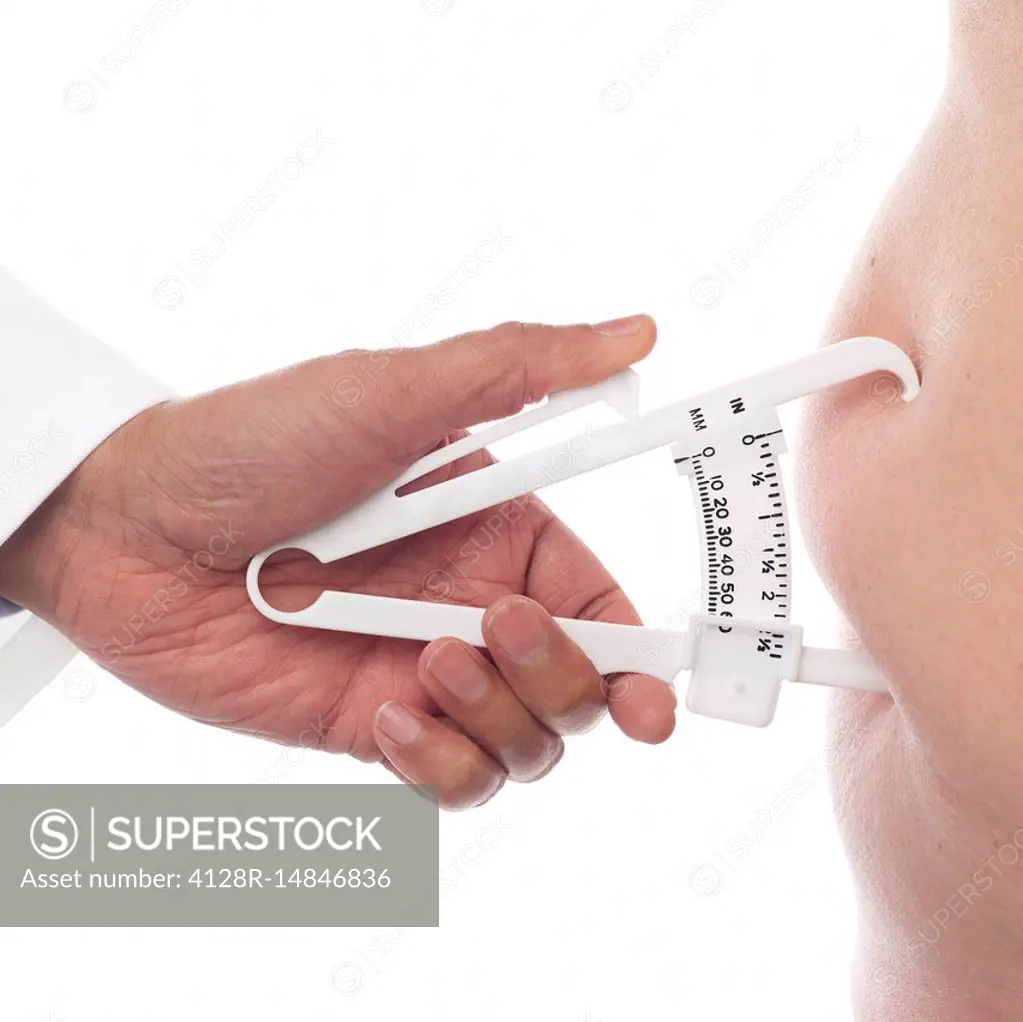 Doctor measuring body fat