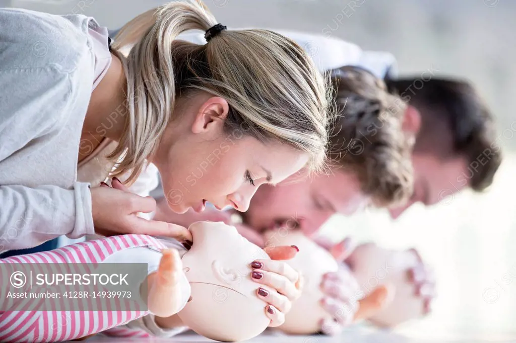 Doctors practising infant CPR