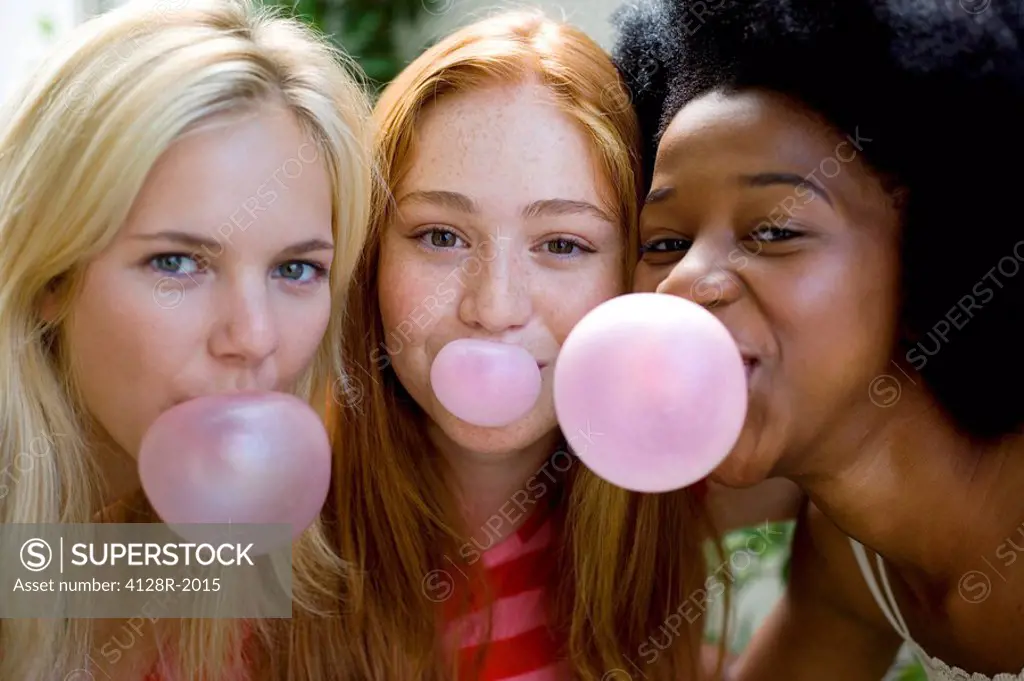 Girls blowing bubblegum