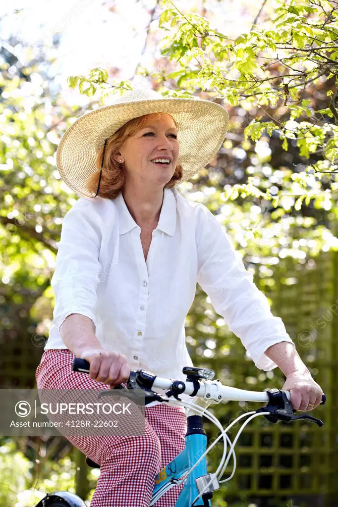 MODEL RELEASED. Woman cycling.