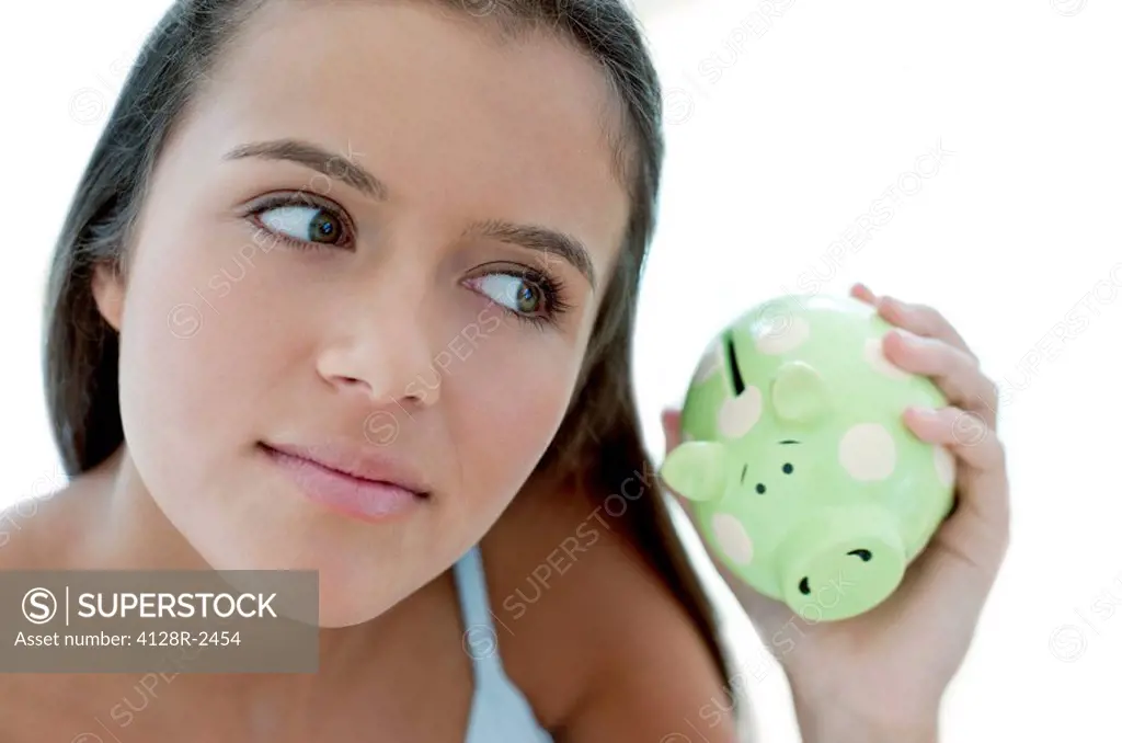 Teenage girl saving money.