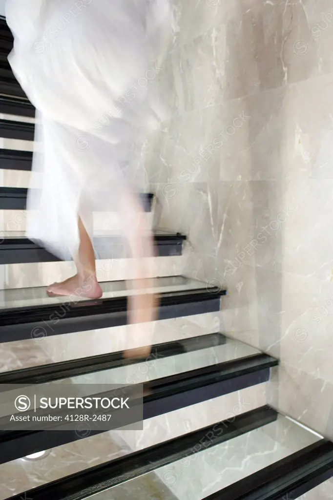 Woman ascending stairs