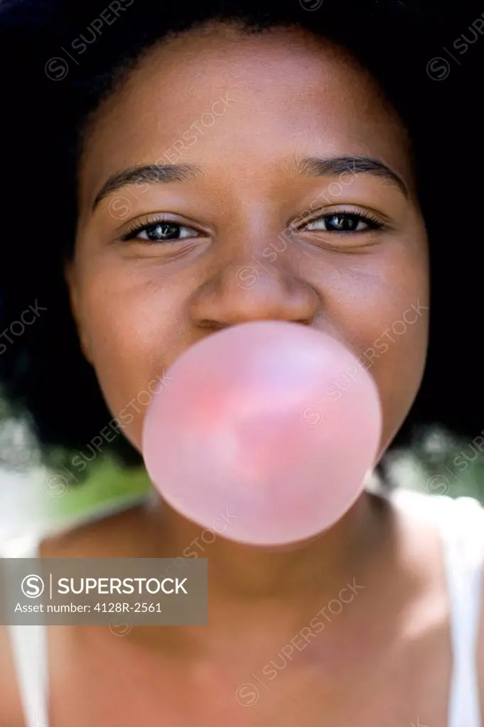 Girl blowing bubblegum
