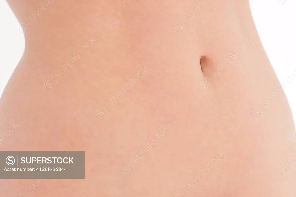 MODEL RELEASED. Woman's abdomen.