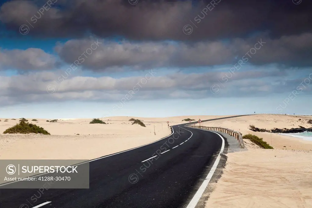Road through sand dunes, Corralejo, Fuerteventura, Canary Islands.