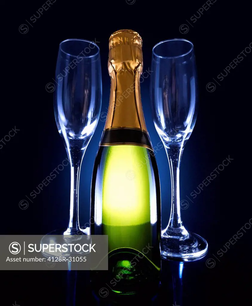 Champagne bottle and two glasses.