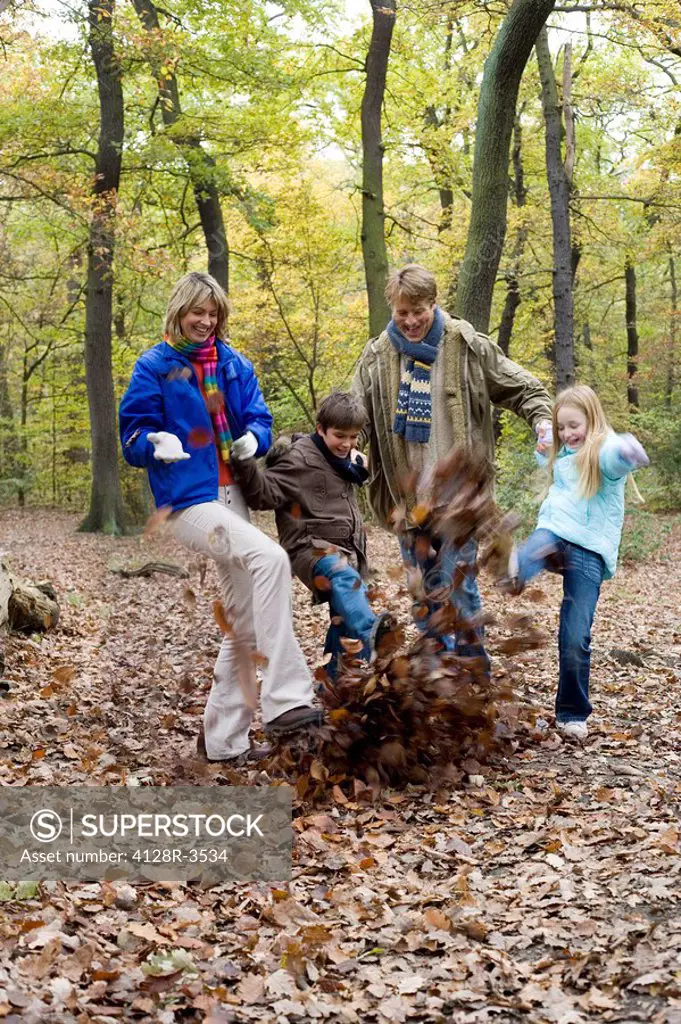 Family playing in a wood