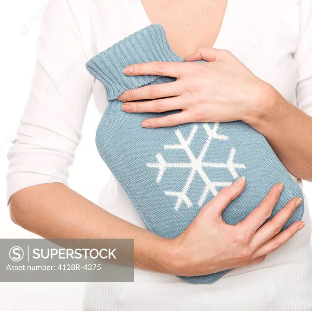 Woman with a hot water bottle.