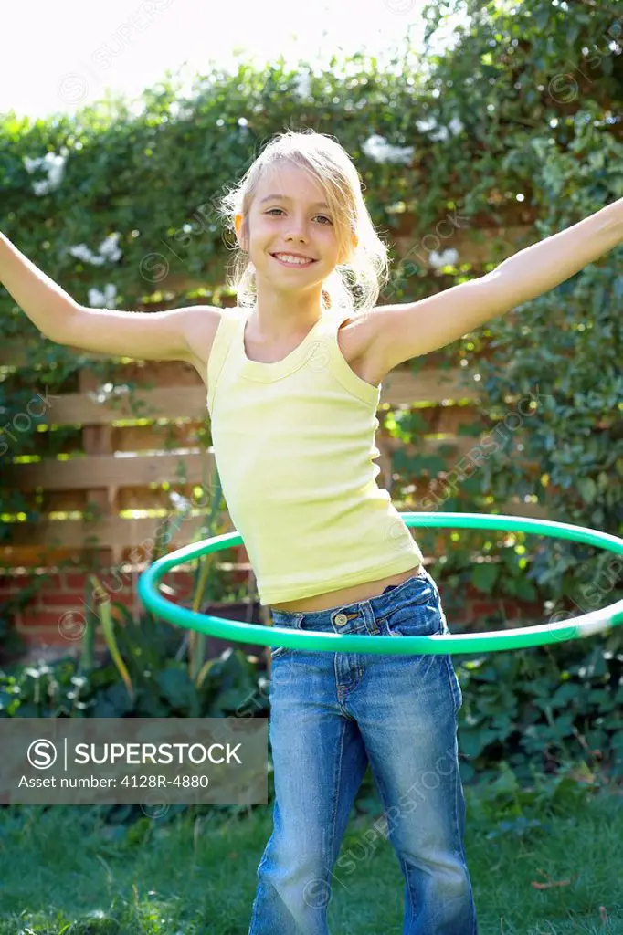 Girl playing with a hula hoop