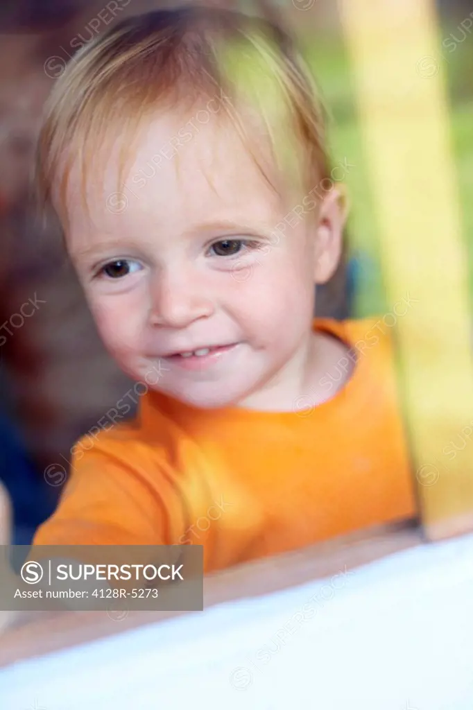 Boy playing in a Wendy house