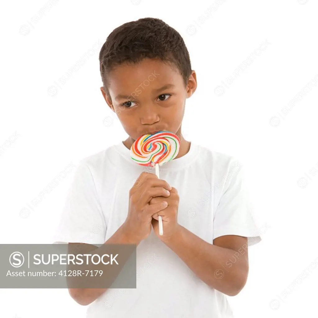 Boy eating a lollipop.