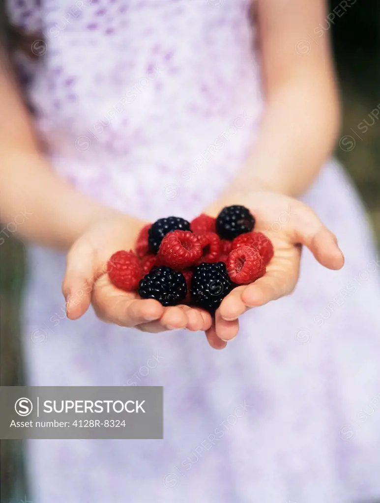 Child holding berries