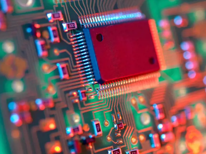 Electronic circuit board containing chips and components.