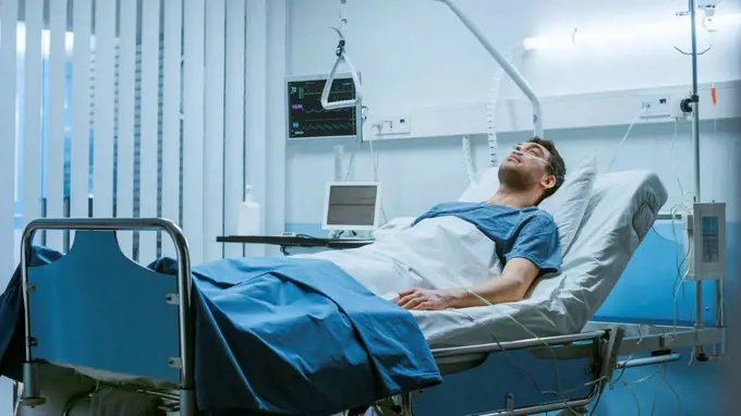 Sick patient lying in a hospital bed