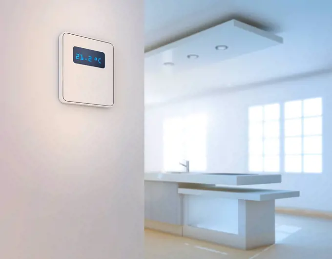 Smart thermostat in domestic kitchen.