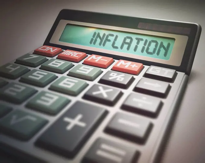 Calculator with the word inflation, illustration.