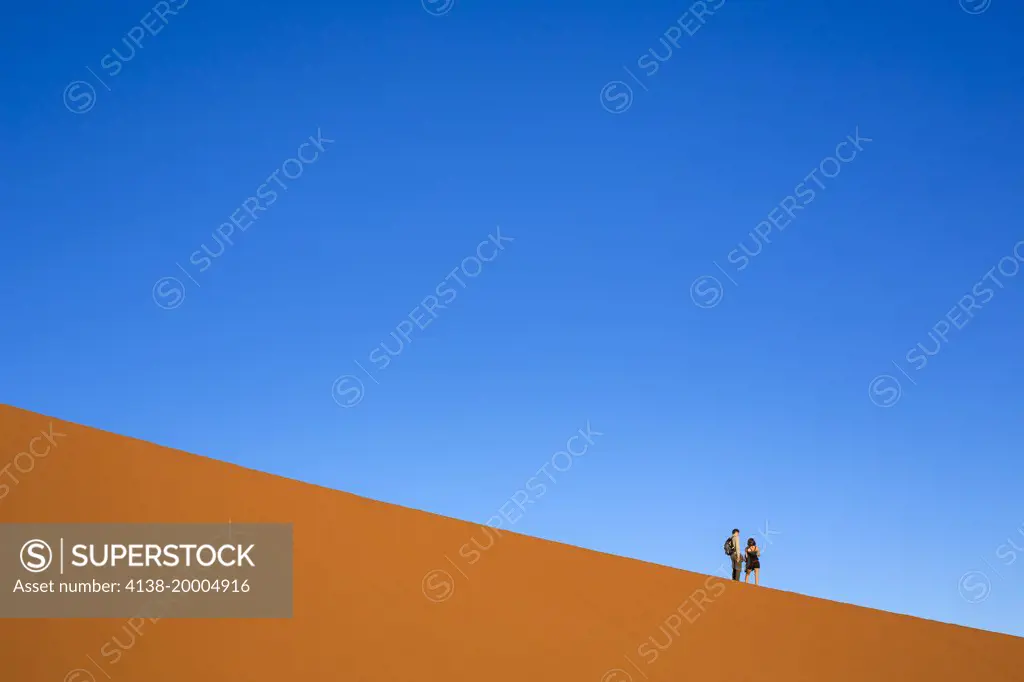 Tourists climbing Dune 45 Sossusvlei.Namibia