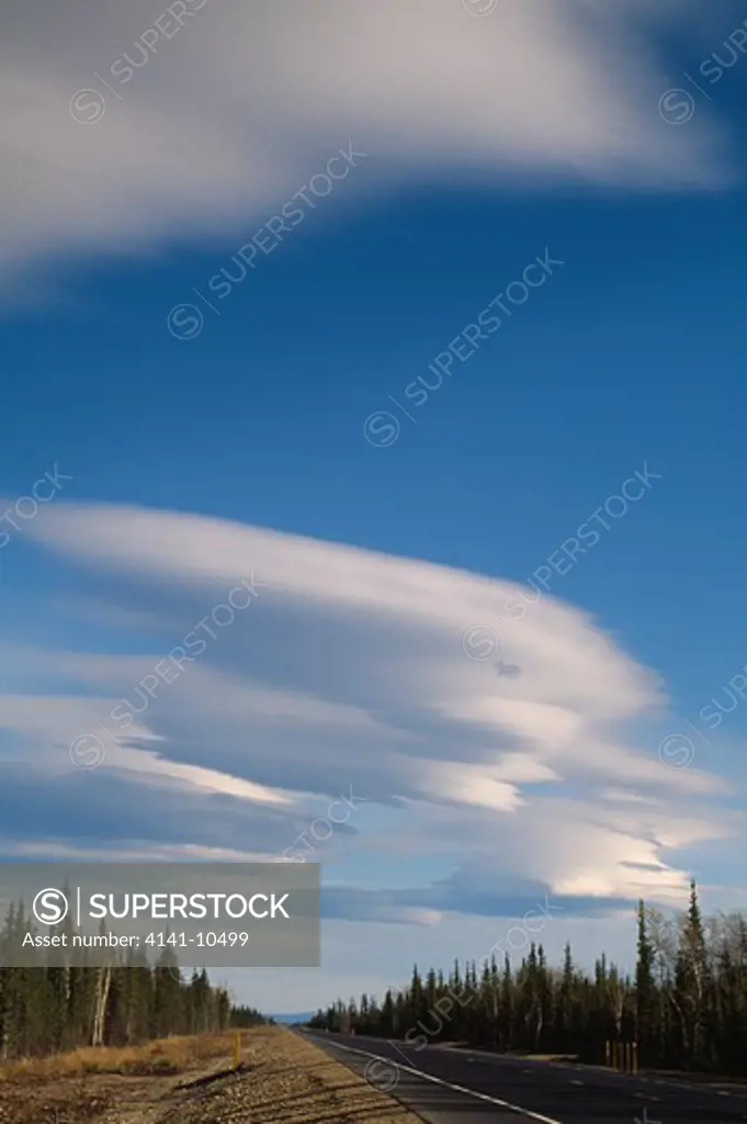 lenticular clouds altocumulus lenticularis on weather front, caused by wind-induced wave patterns, often on lee of mountains