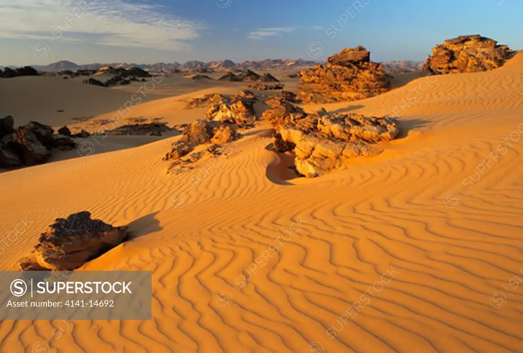 rocks & dunes at sunrise akakus desert, sahara, fezzan, libya. 