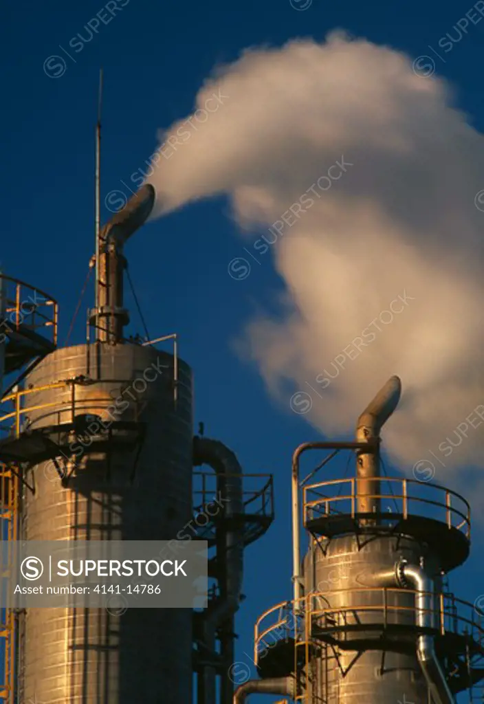 kapuni gas treatment plant discharging carbon dioxide (co2) emissions from chimneys. kapuni, taranaki, north island, nz.