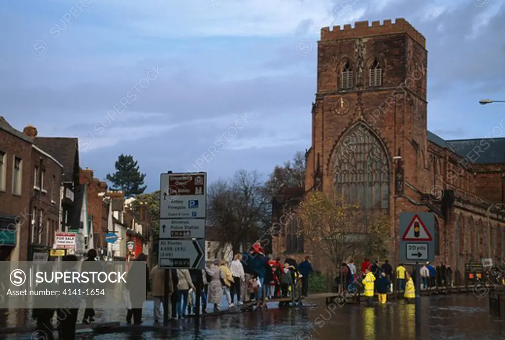 floods in town floodwater from river severn in centre of shrewsbury, shropshire, west midlands of england