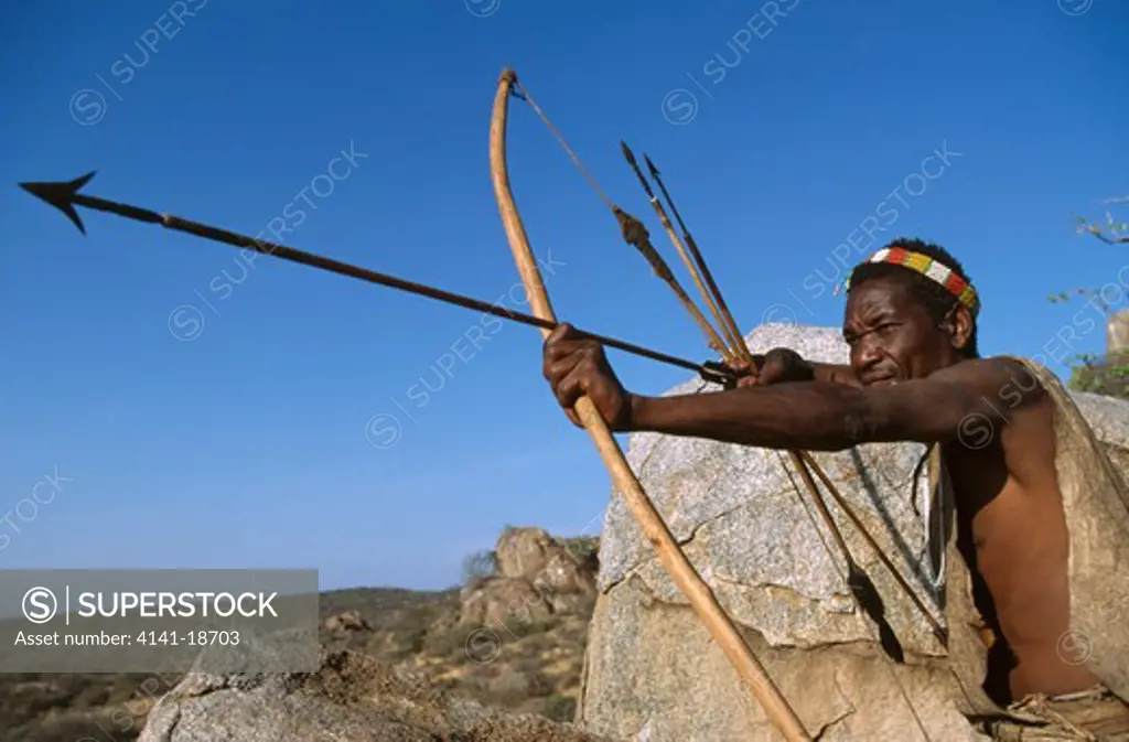 hadzabe hunter with bow and arrow lake eyasi area, tanzania