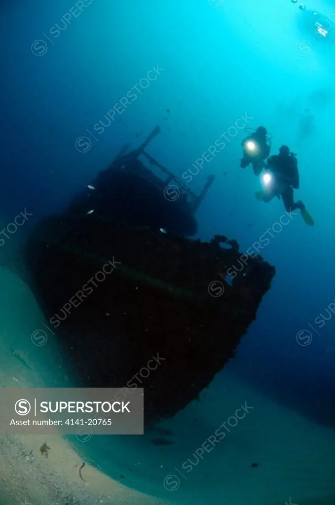 divers on the tug boat