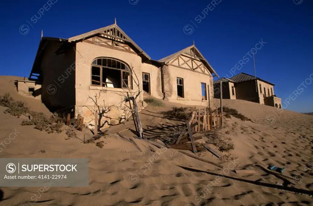 abandoned mining town (diamond mining ceased in 1958) being reclaimed by the desert. kolmanskop, luderitz, namibia. 