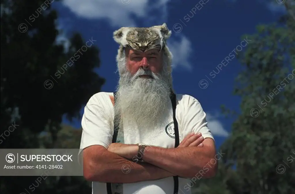 dr. john wamsley wearing feral cat hat. founder & managing director of earth sanctuaries limited. feral cats are a threat to endemic australian wildlife.
