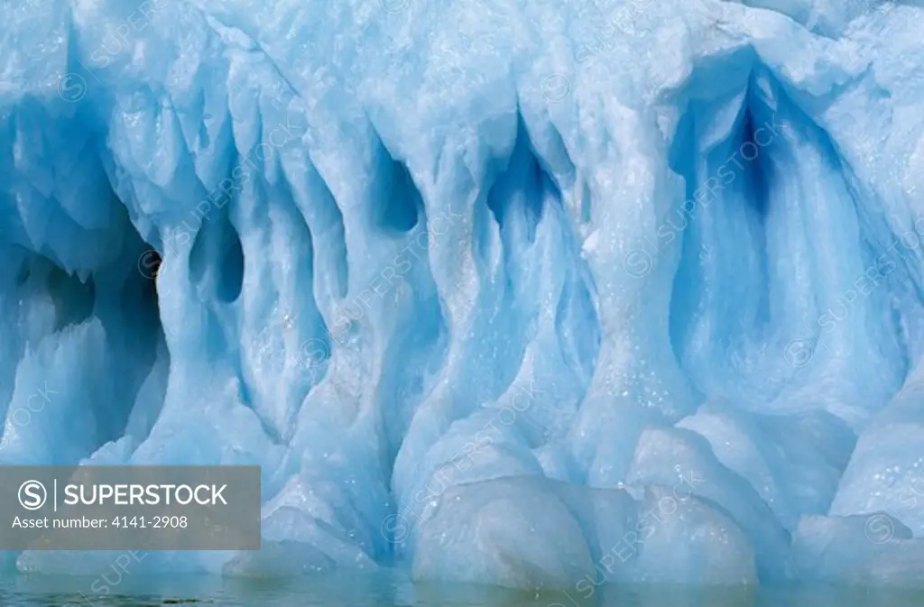 blue iceberg with ice pillars antarctic sound off antarctic peninsula 