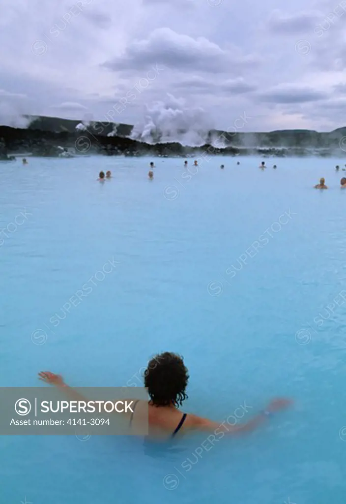 bathers in blue lagoon near reykiavik, iceland silica-rich thermal pool