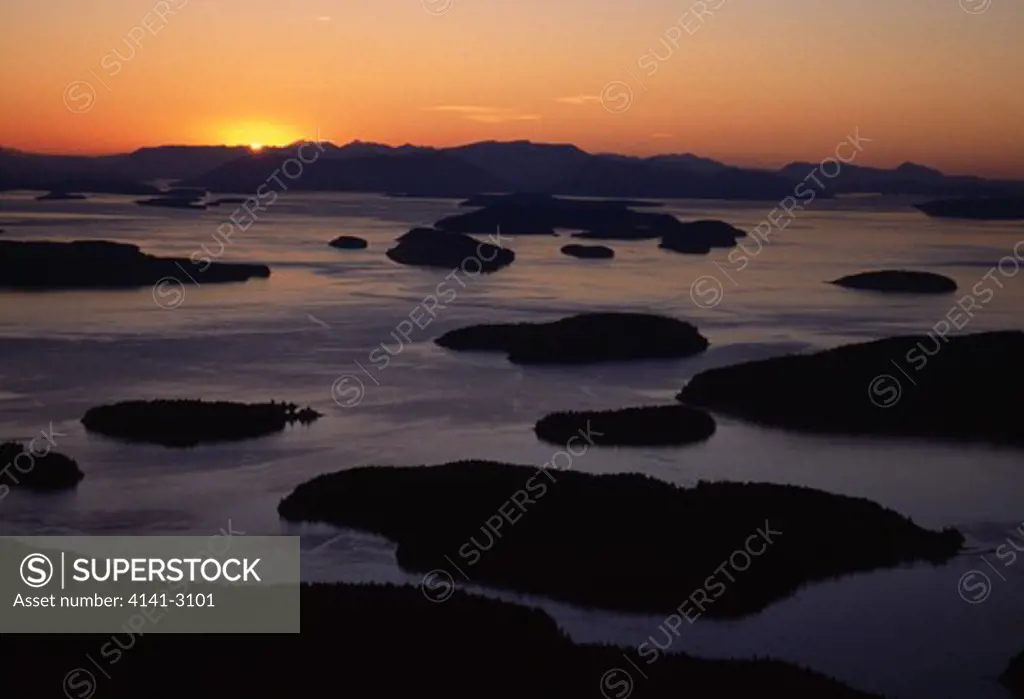 san juan islands at dusk wasp islands, aerial view sun setting ovr vancouver island washington, usa