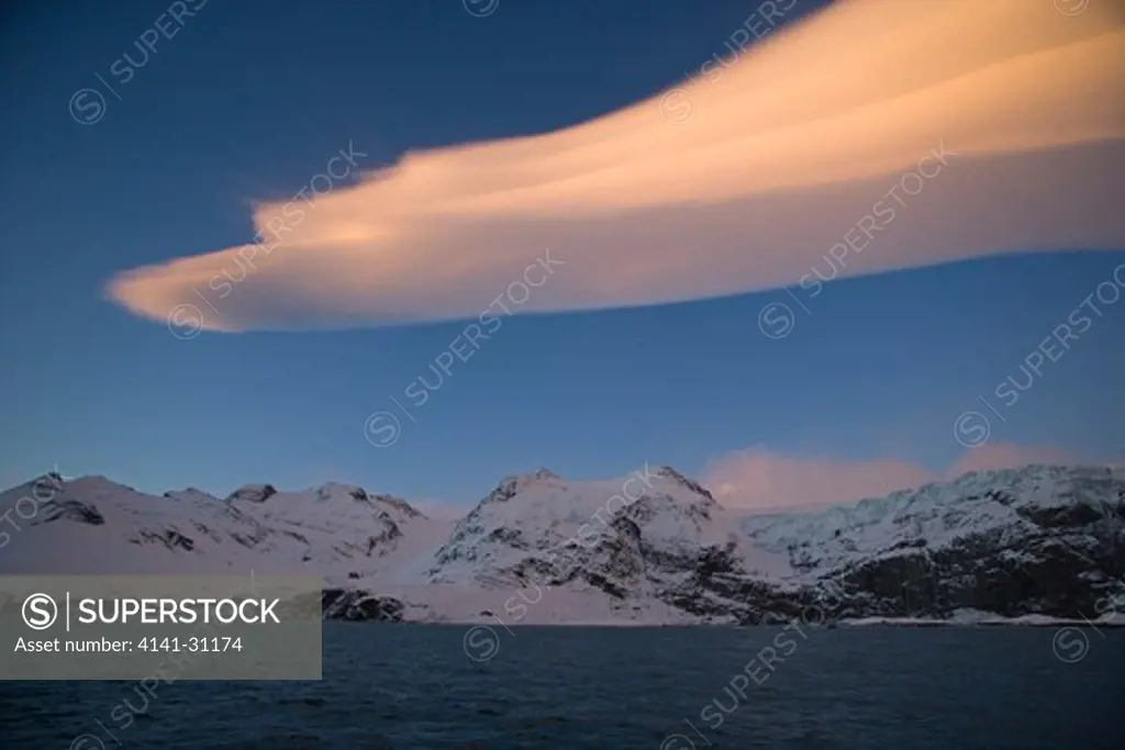 lenticular clouds over gold harbour at dawn; south georgia
