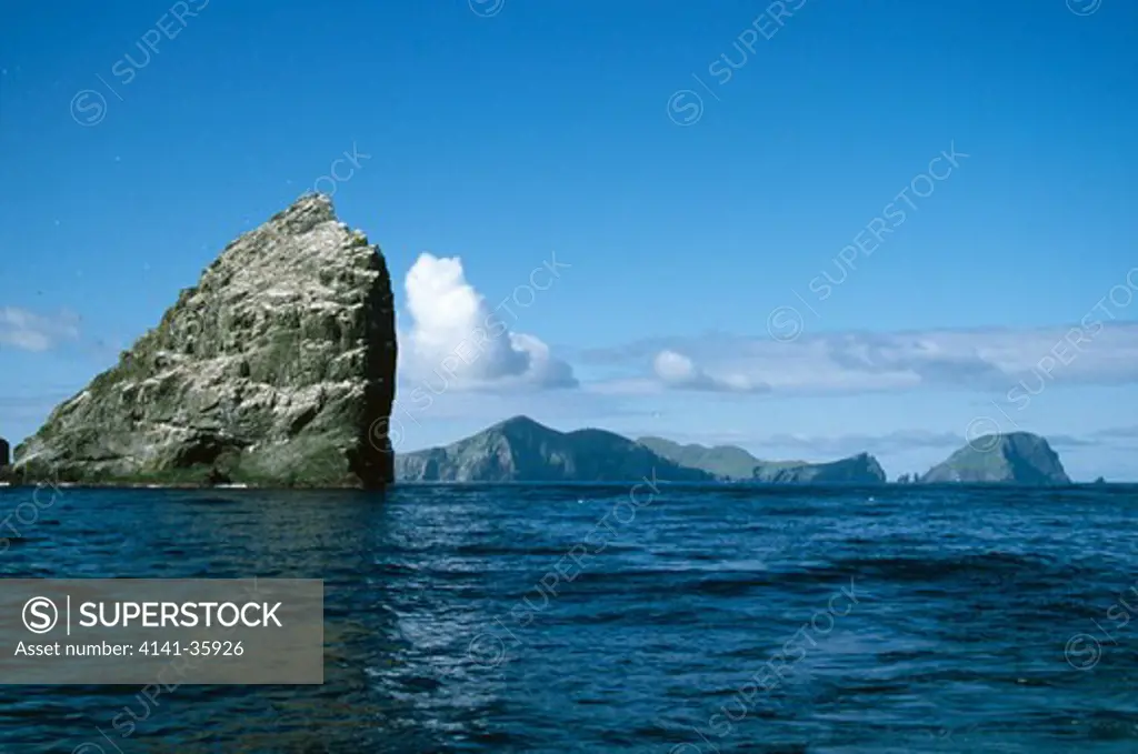 stac an armin sea stack, st. kilda with hirta & soay in background. june. scotland. sea stacks are created when waves erode through a thin headland