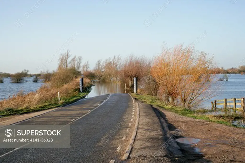 flooded road across ouse washes near welney norfolk, uk november 