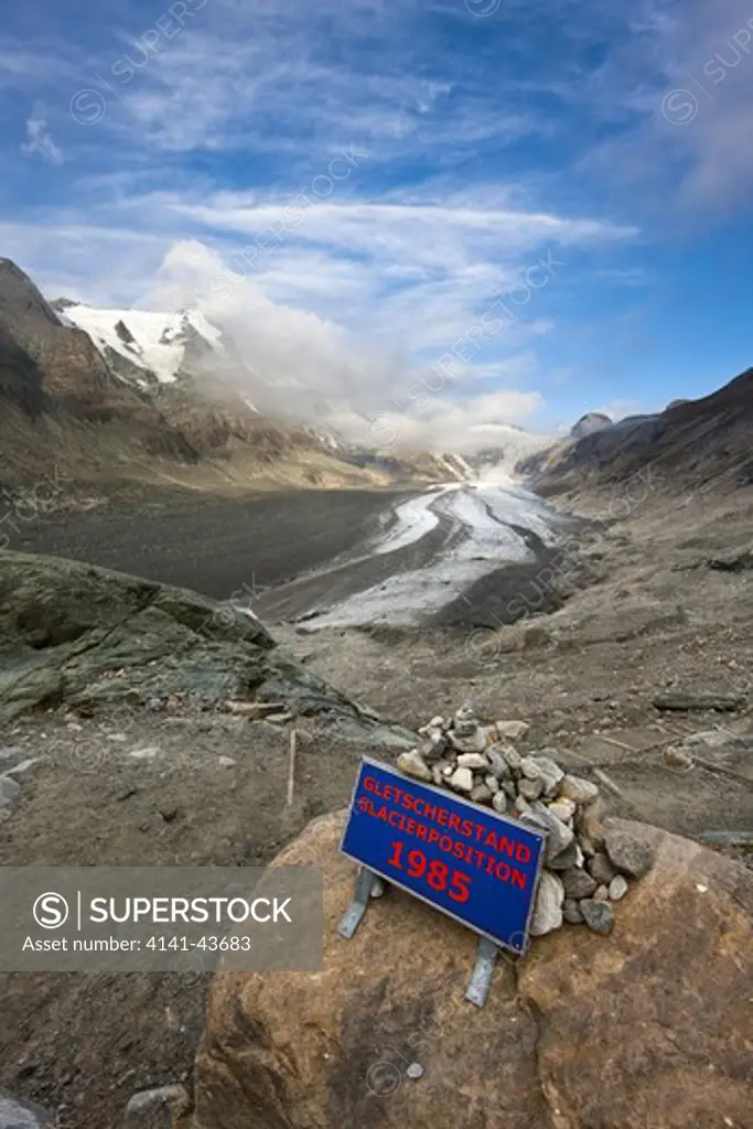 retreat of glacier pasterze of mount grossglockner with a sign showing the glacier position 1985 europe, central europe, austria, october 2009
