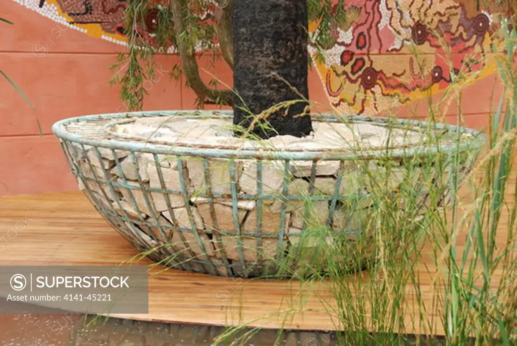 fleming's and trailfinder's australian garden, a close-up of one of the gabion bowls used as planters for large australian trees and some of the aboriginal art of this gold medal winning show garden at the 2008 chelsea rhs show, london, uk. date: 10.10.2008 ref: zb898_121950_0011 compulsory credit: photos horticultural/photoshot 