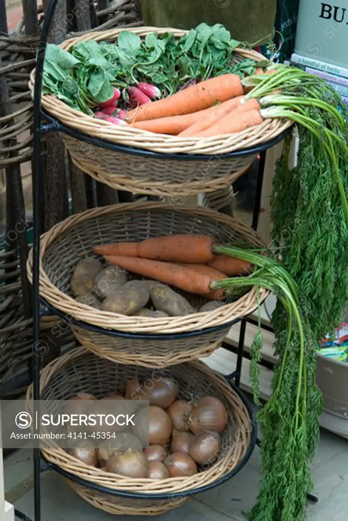 stacked vegetable baskets containing radishes, carrots, potatoes & onions (hartley botanic ltd/chelsea flower show 2008) date: 19.11.2008 ref: zb899_124741_0015 compulsory credit: photos horticultural/photoshot 