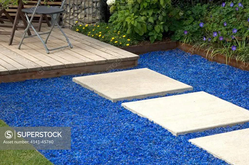 path slabs surrounded with contrasting crushed blue glass. date: 18.11.2008 ref: zb907_124712_0023 compulsory credit: photos horticultural/photoshot 