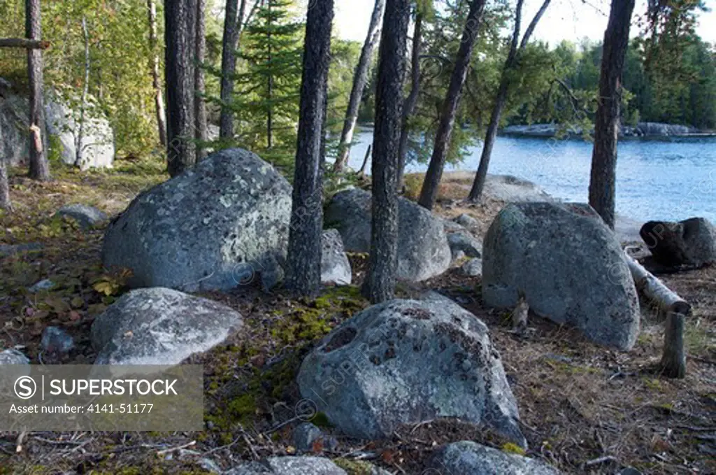 Lichen Covered Rocks Or Boulders On Nym Lake In Quetico Provincial Park, Ontario, Canada.