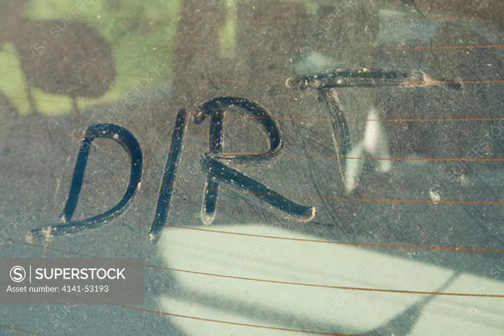 The Word 'Dirt' Written On Car Rear Windscreen Following Saharan Sand Deposited In England By Strong South Easterly Winds