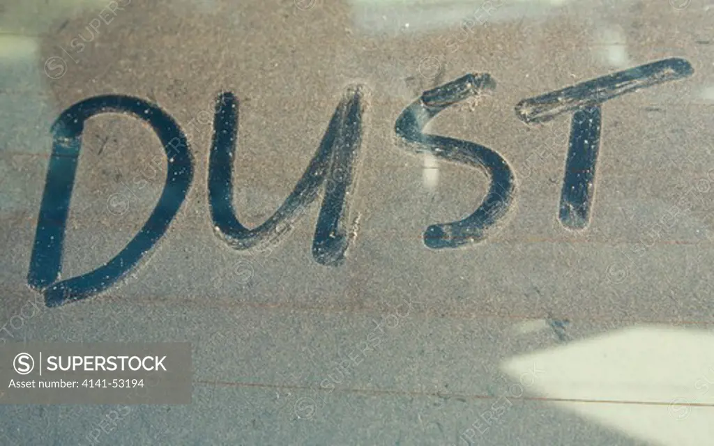 The Word 'Dust' Written On Car Rear Windscreen Following Saharan Sand Deposited In England By Strong South Easterly Winds