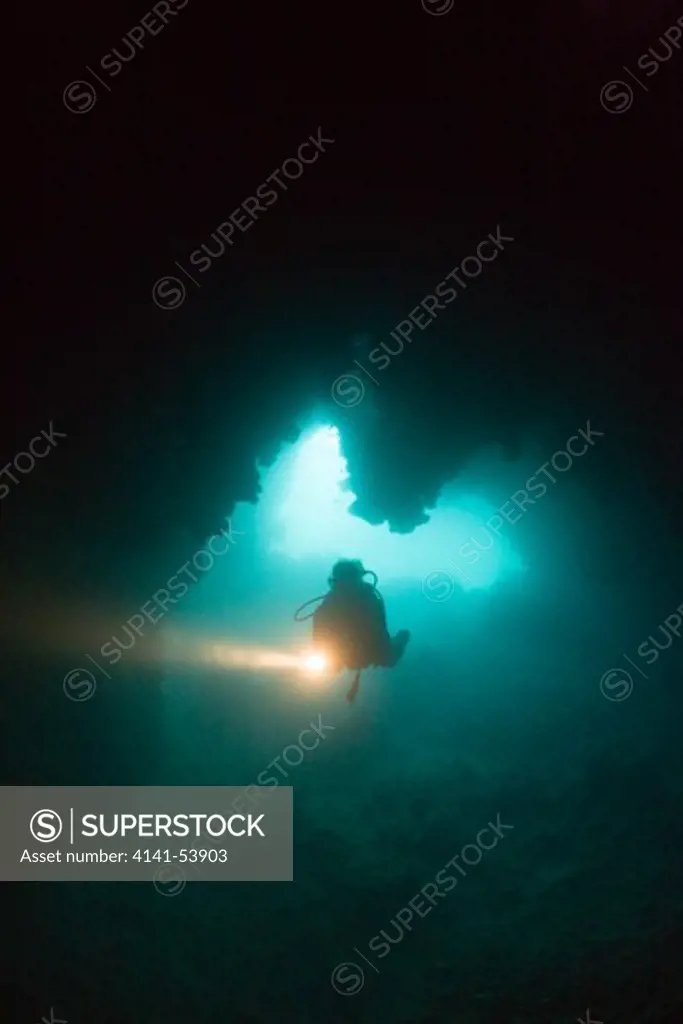 Diver At Entrance Of Chandelier Dripstone Cave, Micronesia, Palau