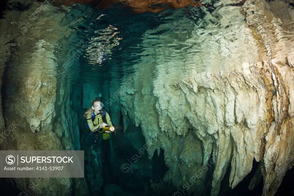 Diver In Chandelier Dripstone Cave, Micronesia, Palau