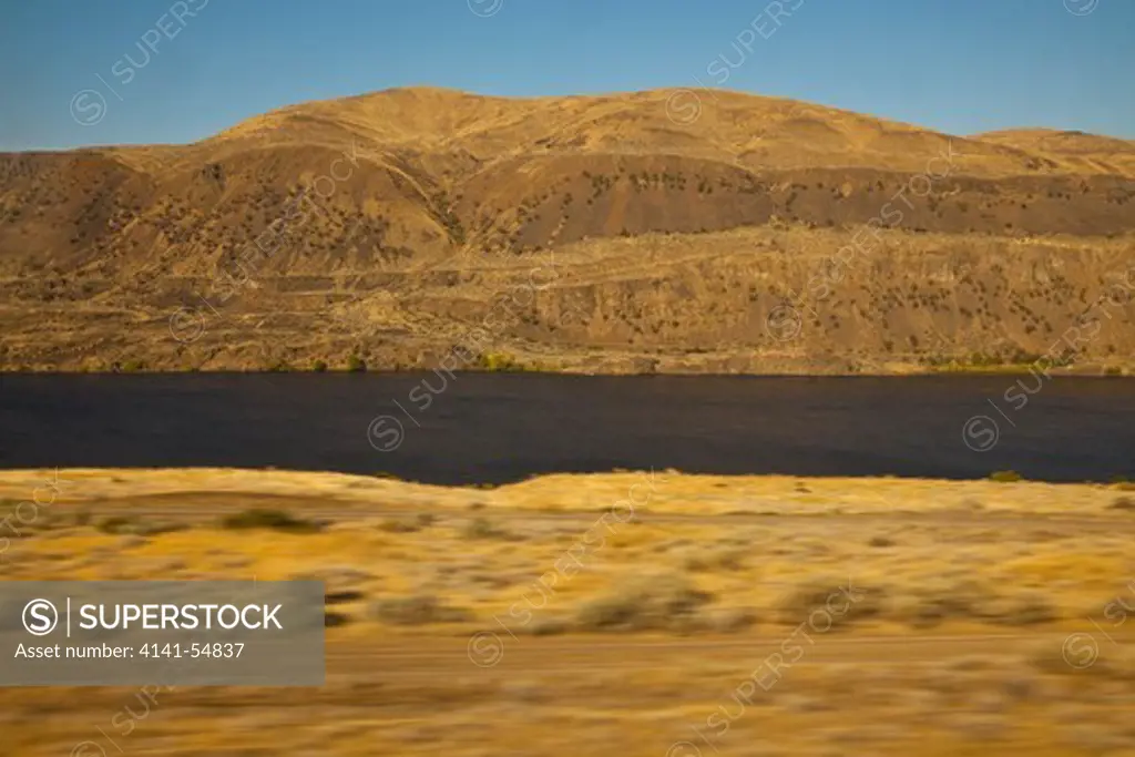 Following The Great Columbia River In Eastern Washington State, Viewed From The Amtrak Empire Builder, With Foreground Motion Blur Due To The Moving Train, Usa, Empire_Builder-371