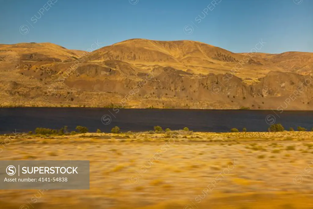 Following The Great Columbia River In Eastern Washington State, Viewed From The Amtrak Empire Builder, With Foreground Motion Blur Due To The Moving Train, Usa, Empire_Builder-372