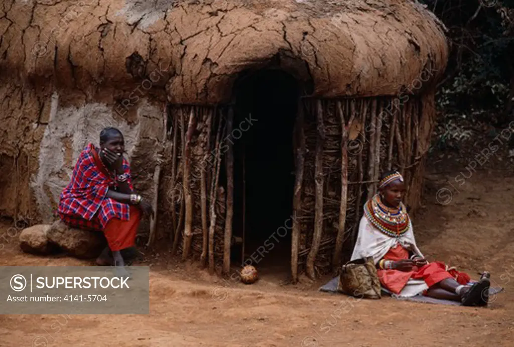 masai people outside hut kenya