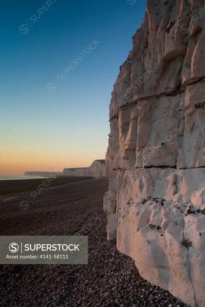 Birling Gap Beach At Sunset, With View Of The Seven Sisters Cliffs, East Sussex, Uk