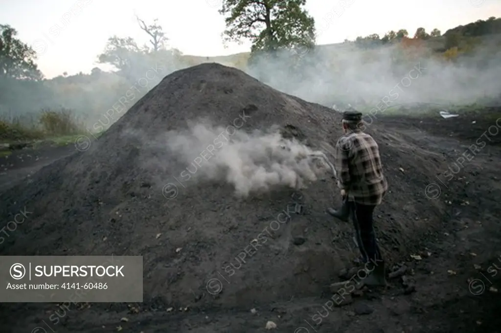 Charcoal Being Made , Project Supported By Eec , Through Ngo Adept To Maintaincoppicing And Sustainable Landscape Management