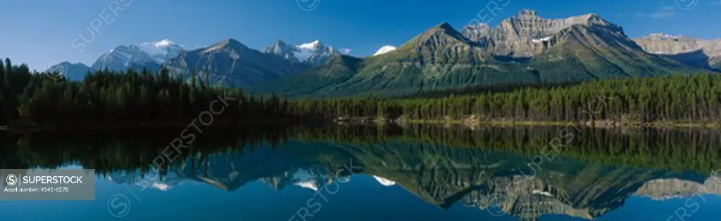 mountains & reflections herbert lake, banff natl park, alberta, south western canada 